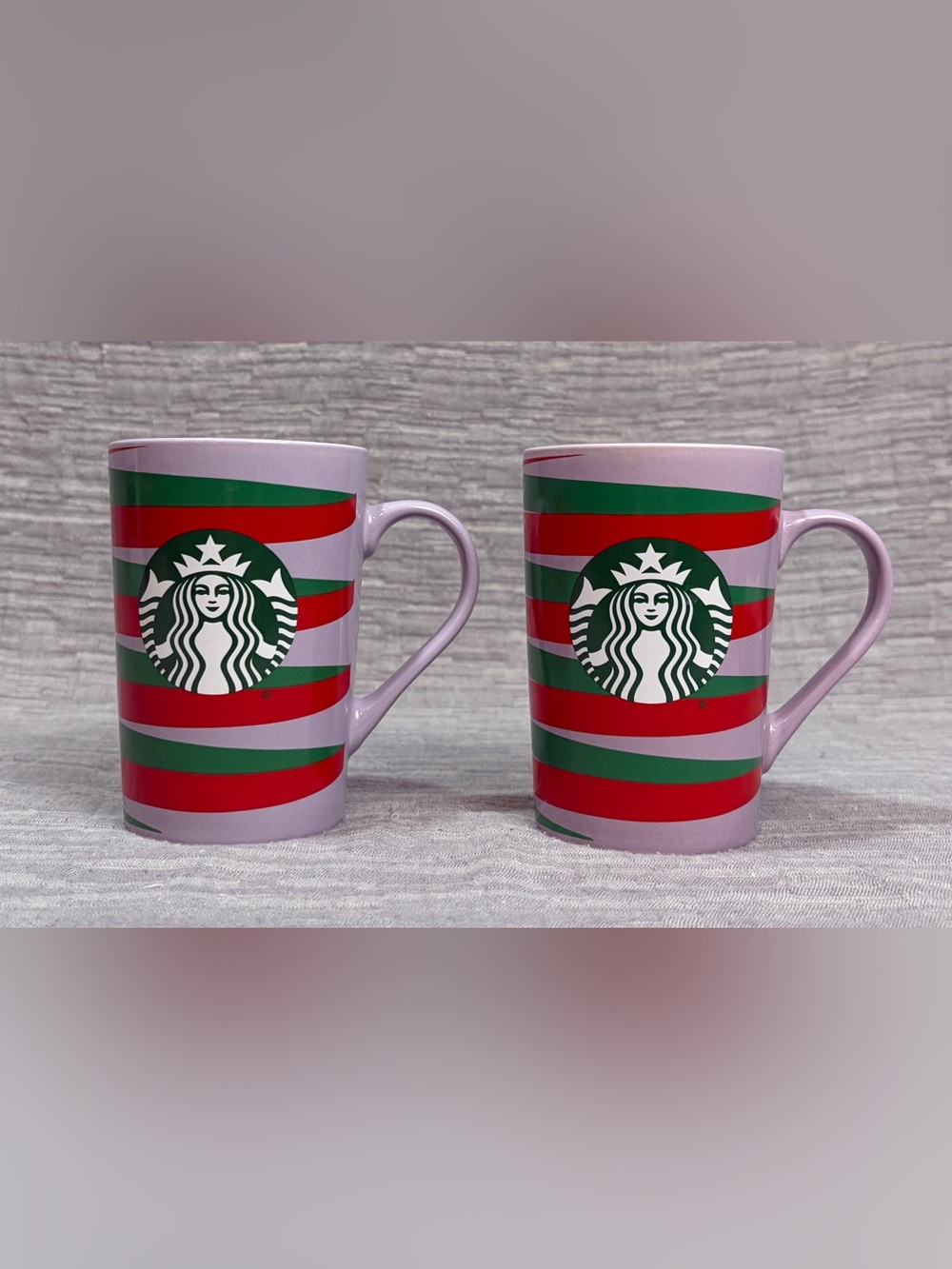 Starbucks 2020 Holiday mug with red and green stripes on a purple background